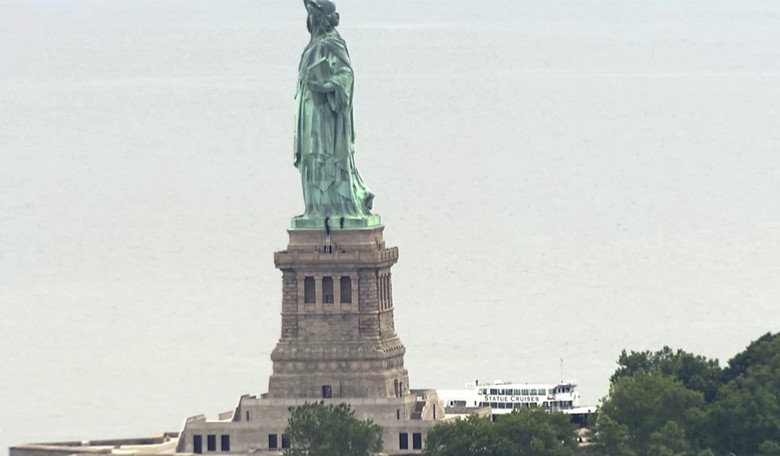 'Abolish ICE' Group Distances Self From Woman Who Scaled Statue of Liberty