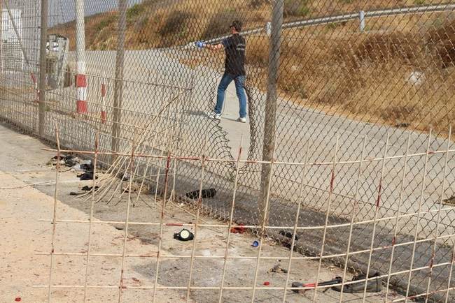 NextImg:Migrants Rush Border Wall in Attempt to Gain Asylum/Work... in Spain