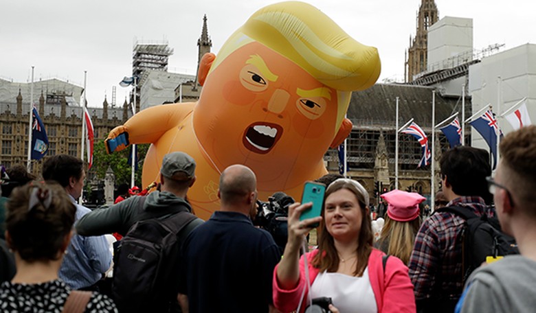 Give This Woman A Medal: Pro-Trump Supporter Bursts 'Baby Trump' Protest Balloon; UPDATE: It's Mostly Tourists Protesting