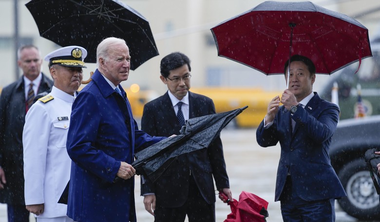 WATCH: Biden Wanders Aimlessly in Rain, Karen Handlers Shoo Away Press