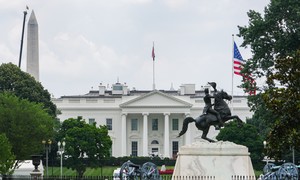 CCP Intelligence Official — Trained As a Sniper — Buys Building 650 Feet From White House