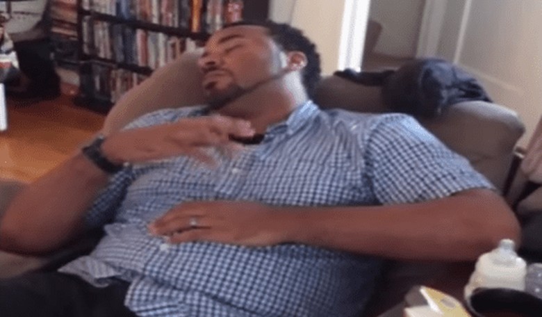 This Sleep-Deprived Dad Rocking the Baby He's Not Even Holding Is Everything