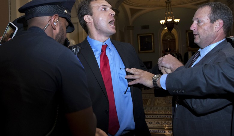 'Protester' Who Threw Russian Flags at Trump Is Longtime Dem Political Operative Ryan Clayton