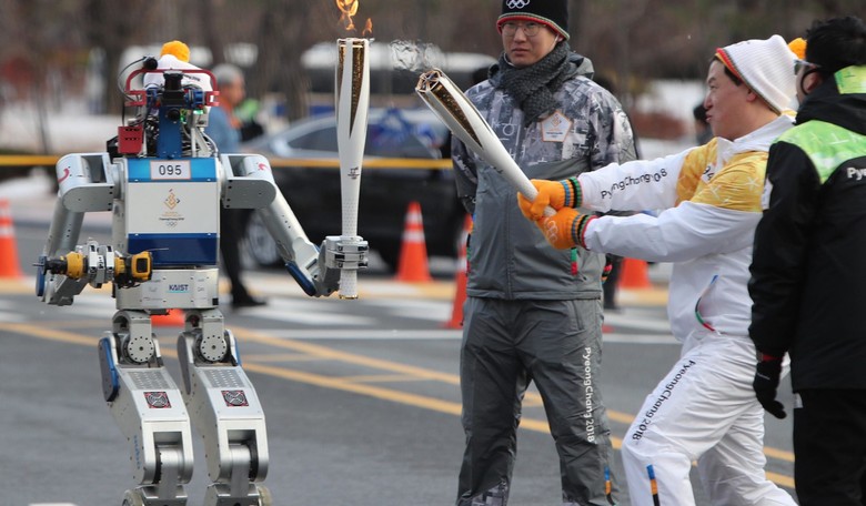 Humanoid Robot Carries Olympic Torch