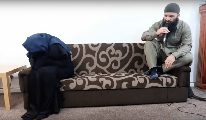 WATCH: Woman in Burqa Writhes Back and Forth as British Imam Spits on Her in Islamic Exorcism