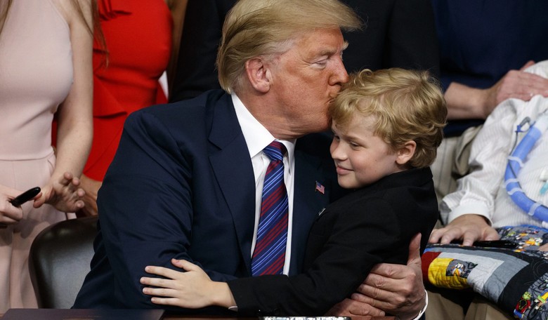 Watch President Trump Hug Little Boy Battling Deadly Disease During 'Right to Try' Signing