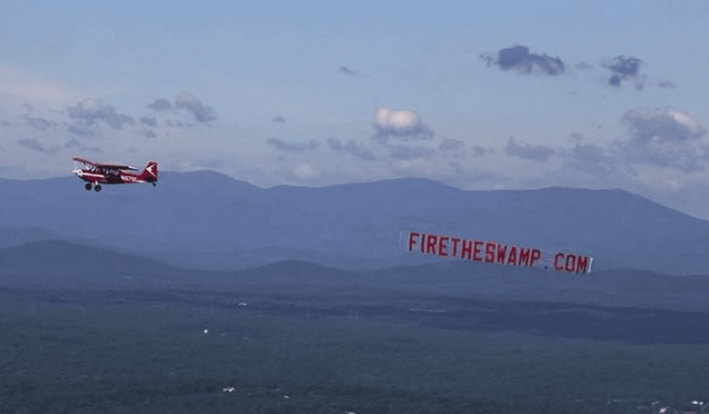 'Fire The Swamp' Banner Flies Above Washington, D.C. During the Morning Commute