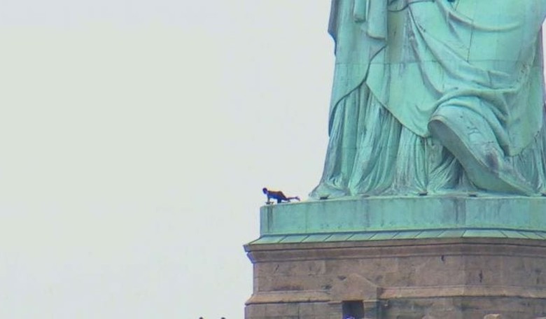 WATCH: Woman Climbs Statue of Liberty, Forces Evacuation