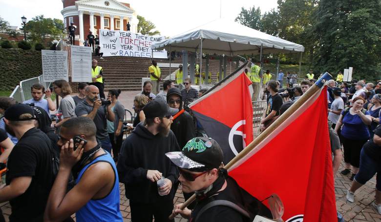 Left-Wing Agitators Tussle With Police and Media at 'Largely Peaceful' Vigil in Charlottesville