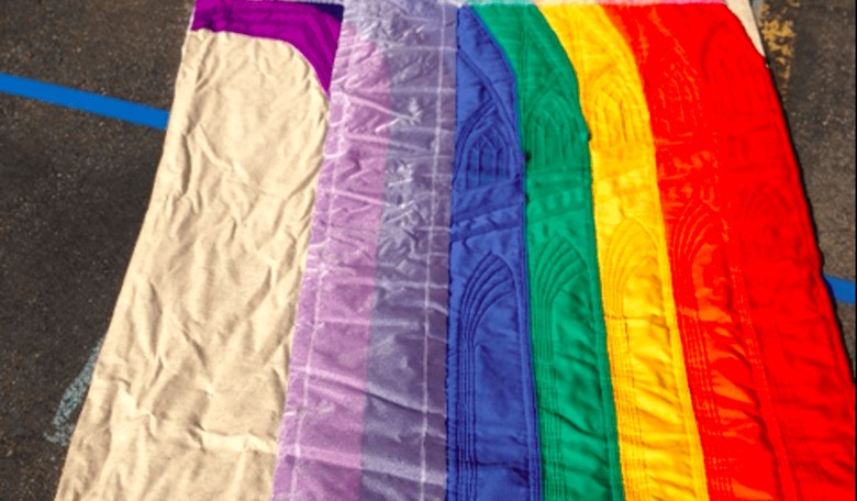 Priest Expelled for Burning LGBT Flag in Exorcism Says the 'Battle of Armageddon' Is Happening Now