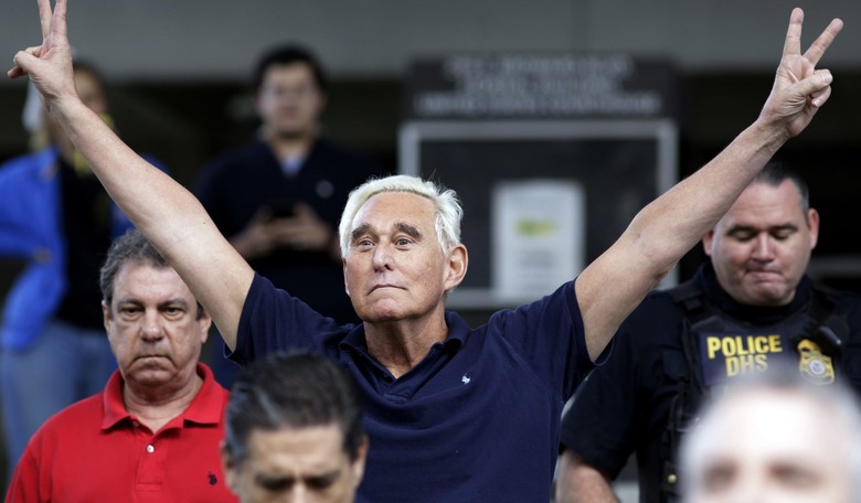 Watch: Defiant Roger Stone Flashes 'V' Sign as Lefties Chant 'Lock Him Up'