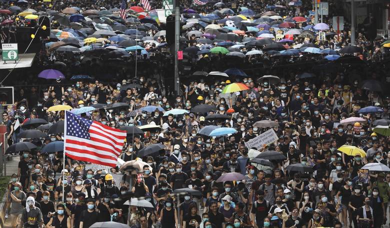 Four Questions as Hong Kong Rises to Protest China's Communists