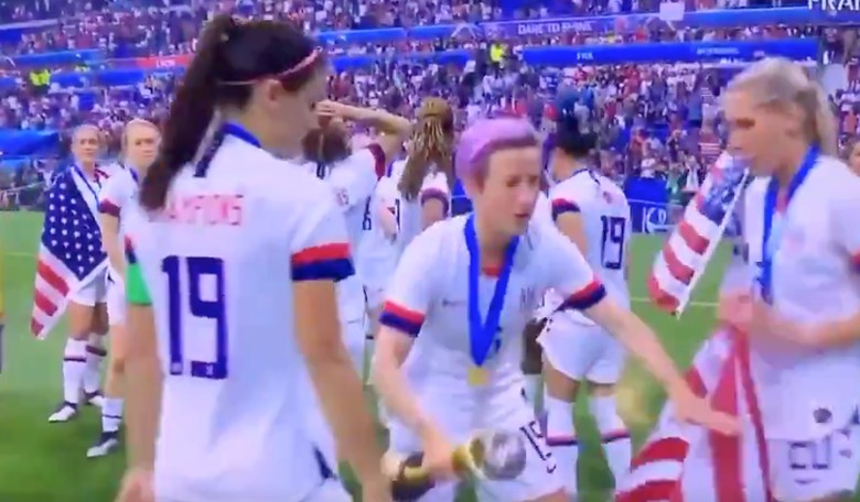 WATCH: U.S. Soccer Player Allie Long Drags and Drops American Flag; Kelley O'Hara Jumps in to Save It