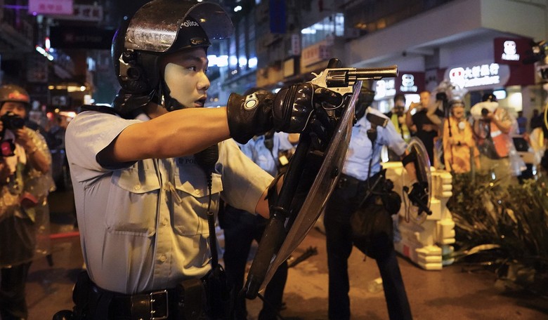 Police Officer Fires the First Shot in Hong Kong Protests