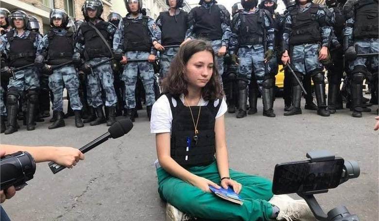 Teenage Girl Arrested after Defying Russian Riot Police by Reading the Constitution During Moscow Protests