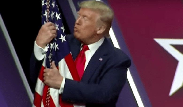 Trump Hugs and Kisses American Flag at CPAC: 'I Love You Baby!'