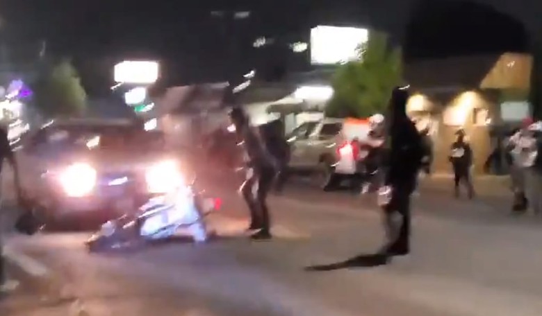 [VIDEO] Watch a Pickup Driver Dispense Street Justice to a Rioter's Bike