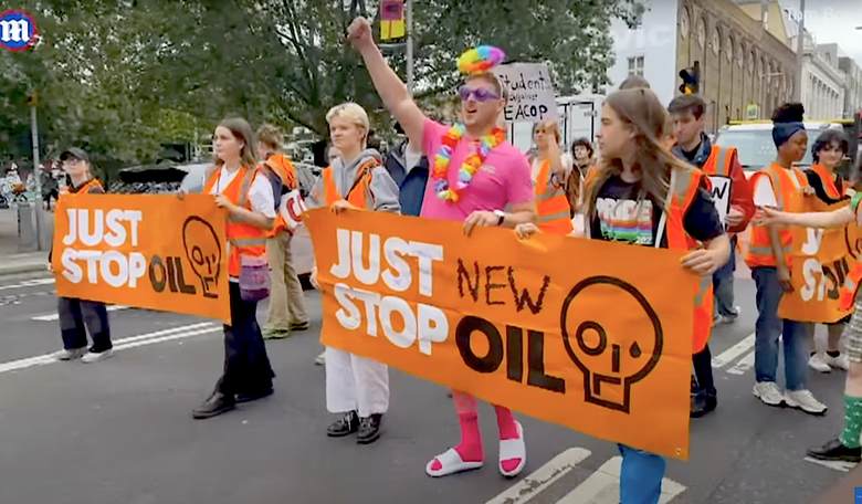 Mad Lads Hijack 'Just Stop Oil' Protest, Take Their Banner on Stag Party Trip to Ibiza
