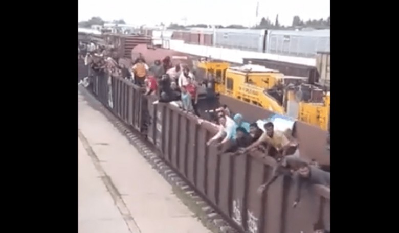 WATCH: Massive Line of Illegal Aliens 'Bum-Rushed' Border, Plus Packed Cheering Train with More on Way