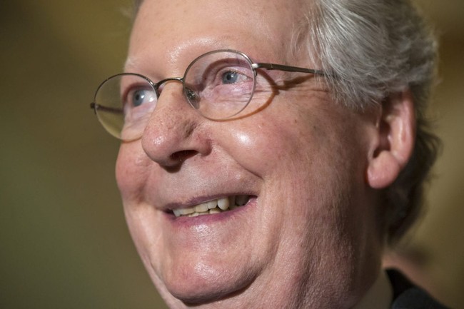 Senate Majority Leader Mitch McConnell of Ky. smiles while answering a reporter's question at a news conference following a closed-door policy meeting on Capitol Hill in Washington, Tuesday, Feb. 23, 2016. The Senate will take no action on anyone President Barack Obama nominates to fill the Supreme Court vacancy, Senator McConnell said as nearly all Republicans rallied behind his calls to leave the seat vacant for the next president to fill. His announcement came after Republicans on the Senate Judiciary Committee ruled out any hearing for an Obama pick. (AP Photo/J. Scott Applewhite)