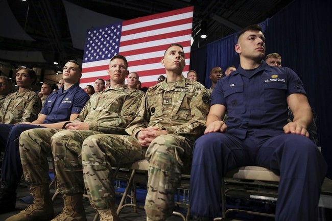 Members of the U.S. Military listen as President Donald Trump speaks at Fort Myer in Arlington Va., Monday, Aug. 21, 2017, during a Presidential Address to the Nation about a strategy he believes will best position the U.S. to eventually declare victory in Afghanistan. (AP Photo/Carolyn Kaster)