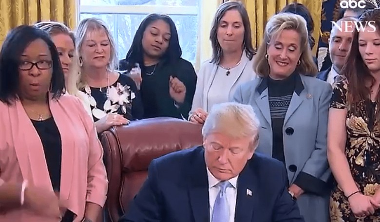 Woman Dances Behind Trump as He Signs Anti-Sex Trafficking Bill