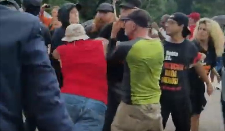 Video: Marine Veteran Launches Into a Group of Leftist Protesters In Order to Rescue a Burning Flag