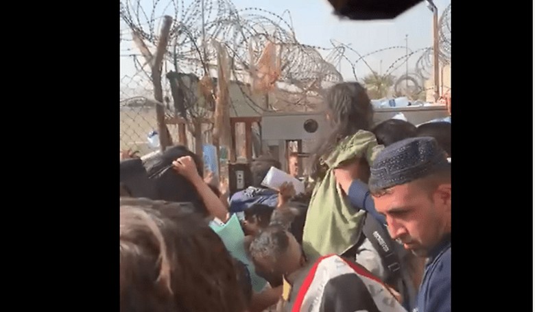 WATCH: Heart-Wrenching Video at Kabul Airport Gate as Parents Pass Babies Forward to Get Them to Safety