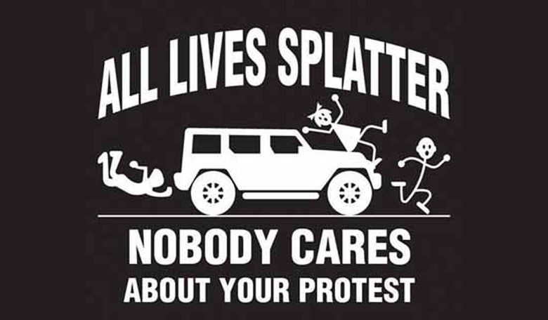 Enjoy this footage of a car not stopping for protesters blocking the road