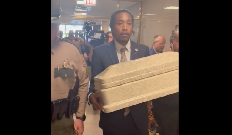 Tennessee 3's head ghoul Justin Jones shoots for 16th minute of fame by bringing tiny casket to work