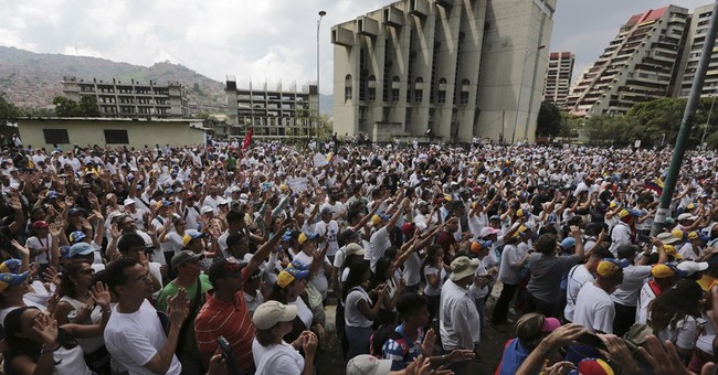 The Latest: Venezuelan protesters cross into western Caracas