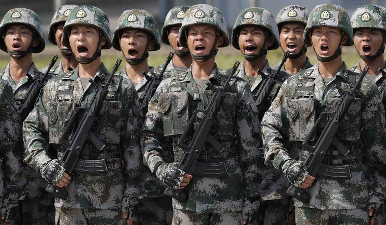 Never Mind Those Hordes of Military-Aged Chinese Men With the Same Clothing, Haircuts, and Tattoos Swarming Our Southern Border