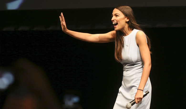 AOC Trips All Over Herself, Forgets Who Built the Cages and Gets a Lesson on Language