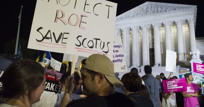 Pro-Abortion Activists Urge Supreme Court to Uphold Roe v. Wade Amid Mississippi Abortion Case