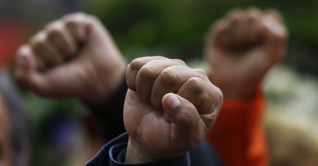 University Students Raise Their Fists Over COVID Restrictions &mdash; They Want Even More