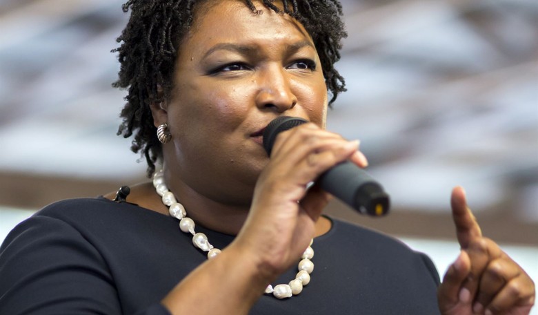 Photo Op Cringe: Grinning Stacey Abrams Sits Among Masked Children With No Mask