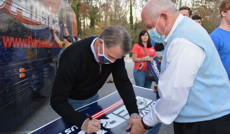 Debunked: No, Sen. David Perdue Did Not Flash 'White Power Sign' in Photo With Trump Supporters