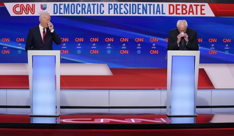 Watch: Biden Coughs In First Question of Debate, Says Doesn't Touch Face Just After He Touched His Face