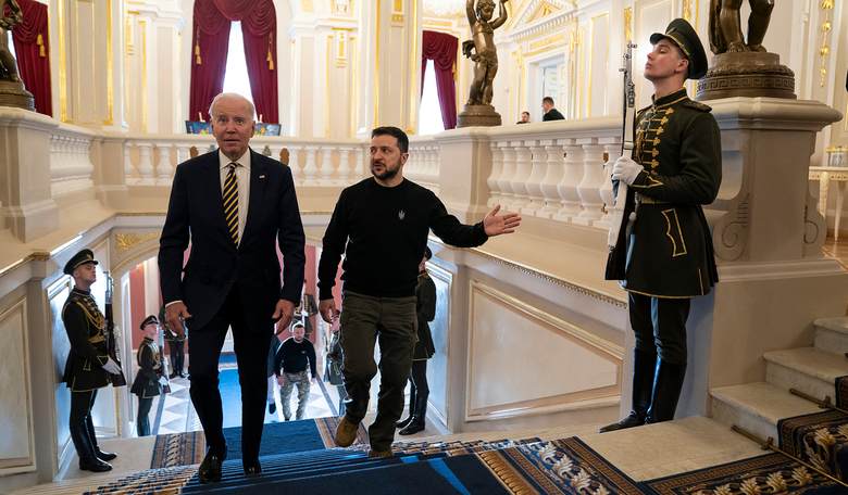 Biden Babbles Before the World in Ukraine, Weirdly Grabs Man's Bicep
