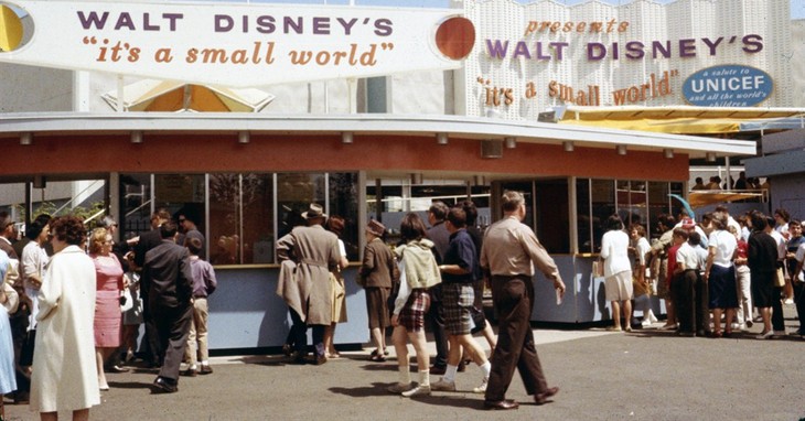 FILE - In this 1964 file photo provided by Disney, shows visitors to the “It’s a Small World” attraction at the 1964 World's Fair in the Queens borough of New York. Along with three oth