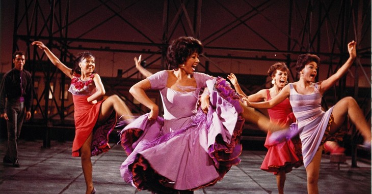This photo provided by courtesy of MGM Home Entertainment shows Rita Moreno, center, as Anita, in the 1961 musical, 