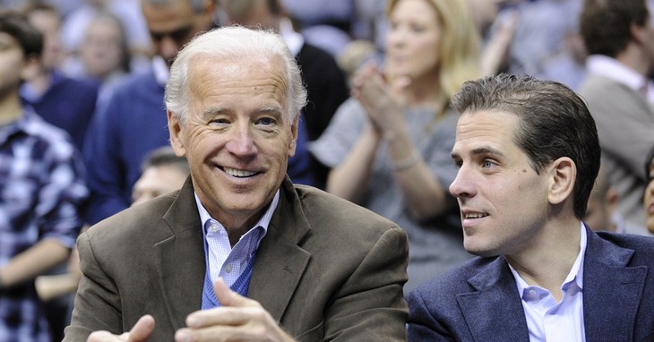 FILE - In this Jan. 30, 2010, file photo, Vice President Joe Biden, left, with his son Hunter, right, at the Duke Georgetown NCAA college basketball game in Washington. Hunter Biden is