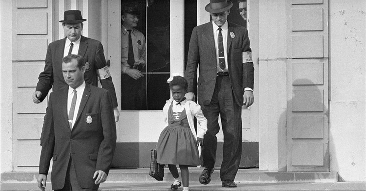 FILE - U.S. Deputy Marshals escort 6-year-old Ruby Bridges from William Frantz Elementary School in New Orleans, in this November 1960, file photo. On Friday, Nov. 14, 2014, 54 years la