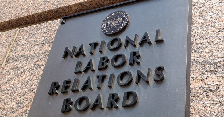 FILE - In this July 17, 2013 file photo, the sign for the National Labor Relations Board is seen on the building that houses their headquarters in Washington. The National Labor Relatio