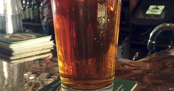 A pint of pub style ale sits on the bar, Wednesday, Feb. 11, 2015, at Gritty McDuff's in Portland, Maine. State Sen. John Patrick is pressing for a bill that would require each pint of