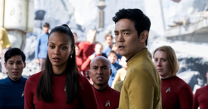 In this image released by Paramount Pictures, Zoe Saldana, left, as Uhura and John Cho as Sulu appear in a scene from, 