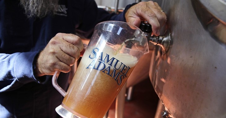Master brewer Bob Cannon, of the Samuel Adams Boston Brewery, pours a pitcher of their 