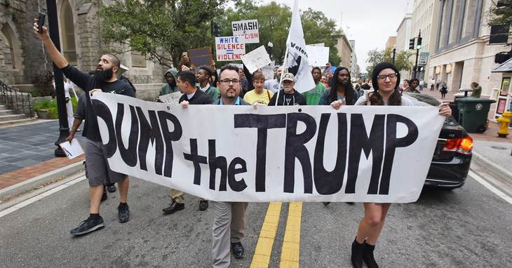 Anti-Trump protesters start their hike from Hemming Park to their announced destination at the offices of The Florida Times-Union newspaper, Saturday, Nov. 12, 2016, in Jacksonville, Fl
