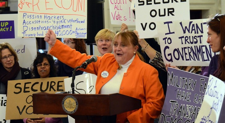 Marybeth Kuznik, center, of VotePA, an election integrity advocacy group, leads a rally at the Pennsylvania Capitol in support of a Green Party-backed quest for a recount of Pennsylvani