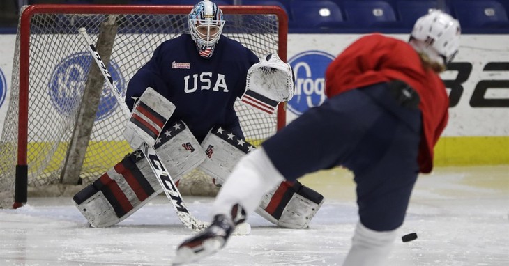 Team USA hockey goalie goalie Alex Rigsby takes a shot on goal during a practice session in Plymouth Township, Mich., Thursday, Dec. 15, 2016. One of the best rivalries on ice, the U.S